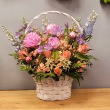Basket with pastel flowers